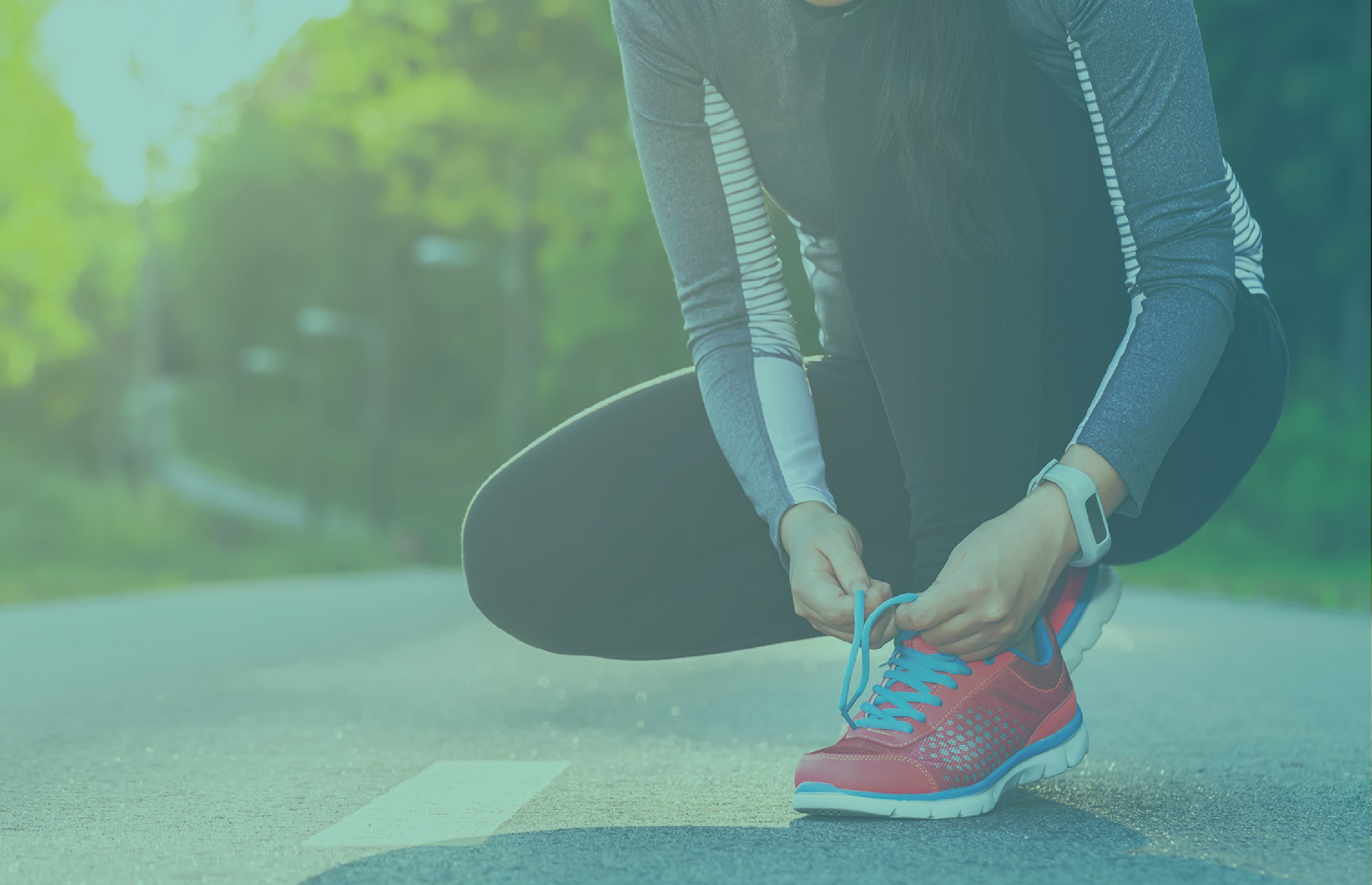 An image of a woman squatting to tie her sneaker's shoelace